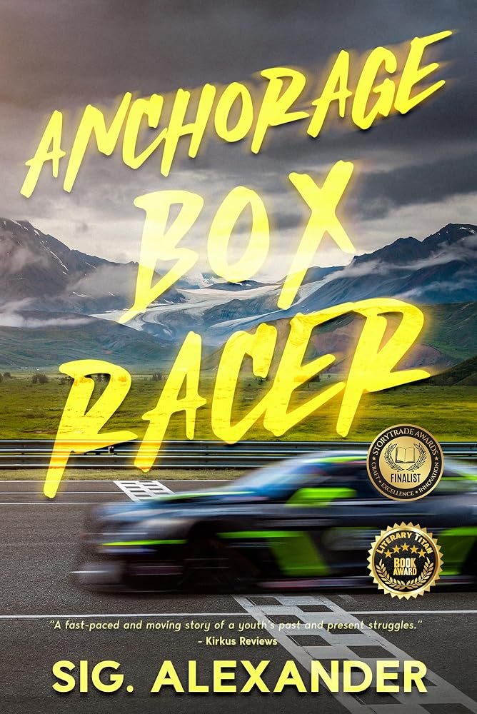 Cover of Anchorage Box Racer: a race car blurs past Alaskan mountains under yellow brush-script lettering.